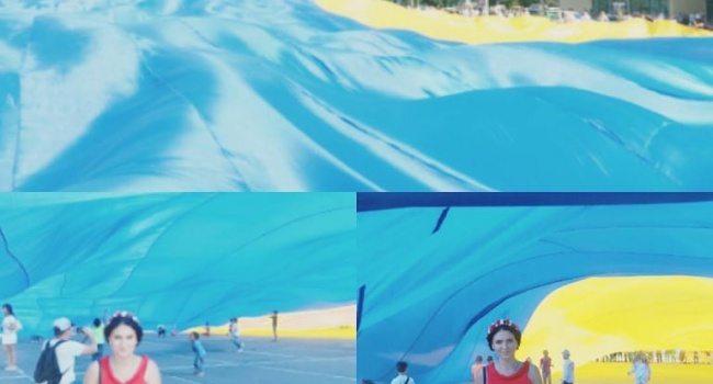 В Сумах устроили флешмоб с гигантским флагом Украины, - фото